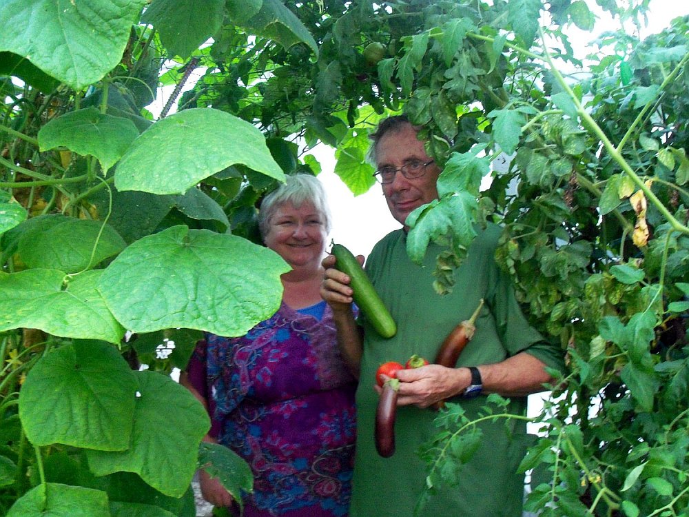 Bob and Margaret in our 11 mils Clear Woven Poly A-Frame Greenhouse